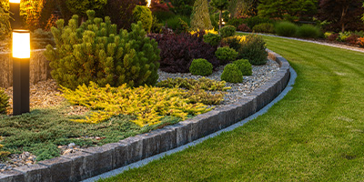 j c landscapes ltd logo featuring stylized text and a tree symbol representing landscaping services and nature related to six essential elements of design